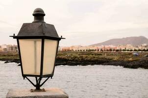 A lantern on the edge of the river photo