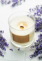 Aroma Candle. Lavender candle on a white tile background. photo
