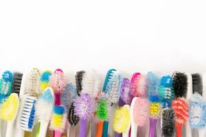 Used Toothbrushes on White Background photo