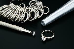 Diamonds and jeweler tools photo