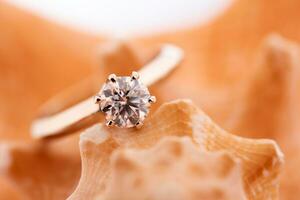 Diamond ring on seashell photo