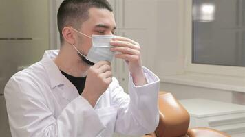 Dentist wears the medical mask video