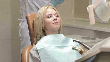 Woman receive checkup at the dentist video