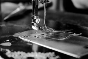 Vintage Black and White Close up Sewing machine and thread, vintage black and white concept photo