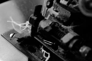 Vintage Black and White Close up Serger or Overlock Machine with threads, vintage black and white concept photo