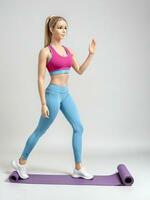 A 3D Toy Sporty Woman Walking With Yoga Mat On A White Background. AI Generated photo