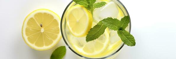 Lemonade in a glass with fresh lemons and mint. Cold summer drink with copy space. Generative AI photo