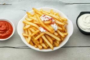 french fries with sour cream and ketchup. background. AI Generative Pro Photo