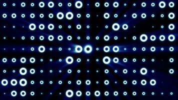 Abstract background of bright blue glowing light bulbs from circles and dots of energy magic disco wall video