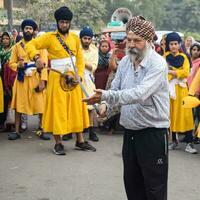 Delhi, India, October 2, 2023 - Sikhs display gatka and martial arts during annual Nagar Kirtan, Traditional, procession on account of birthday of Guru Nanak Dev ji, Nagar Kirtan in East Delhi area photo