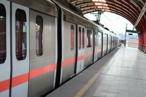 New Delhi India - October 09 2023 - Delhi Metro train arriving at Jhandewalan metro station in New Delhi, India, Asia, Public Metro departing from Jhandewalan station photo