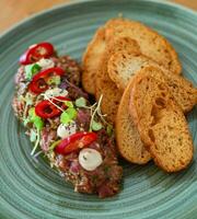 Girona sirloin tartar with focaccia croutons photo