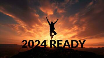 Triumphant Silhouette on Mountain Top with 2024 Ready photo