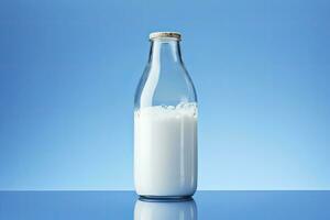 A glass bottle with full milk on blue background. AI Generated photo