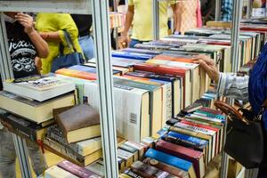 New Delhi, India, September 09 2023 - Variety of Books on shelf inside a book-stall at Delhi International Book Fair, Selection of books on display in Annual Book Fair. photo