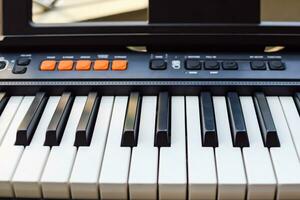 Close-up of piano keys. Piano black and white keys and Piano keyboard musical instrument placed at the home balcony during sunny day. photo