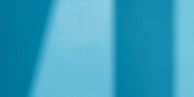 Minimal abstract light blue background for product presentation. Shadow and light from windows on plaster wall. AI Generative photo