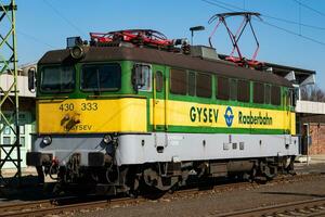 GYSEV Raaberbahn train at station. Railway transport and shipping. International train transportation. photo