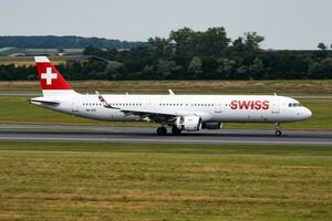 Swiss International Airlines passenger plane at airport. Schedule flight travel. Aviation and aircraft. Air transport. Global international transportation. Fly and flying. photo