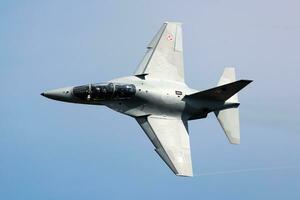 Polish Air Force Leonardo M-346 Master Bielik trainer jet plane flying. Aviation and military aircraft. photo