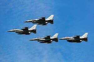 Polish Air Force Lockheed F-16 Fighting Falcon fighter jet plane flying. Aviation and military aircraft. photo