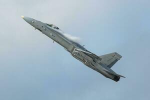 Finnish Air Force Boeing F-18 Hornet fighter jet plane flying. Aviation and military aircraft. photo