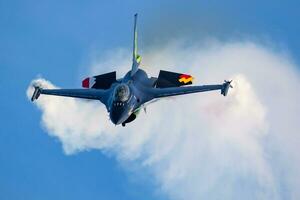 Belgian Air Force Lockheed F-16 Fighting Falcon fighter jet plane flying. Aviation and military aircraft. photo