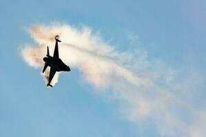 Belgian Air Force Lockheed F-16 Fighting Falcon fighter jet plane flying. Aviation and military aircraft. photo