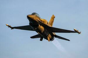 Polish Air Force Lockheed F-16 Fighting Falcon fighter jet plane flying. Aviation and military aircraft. photo