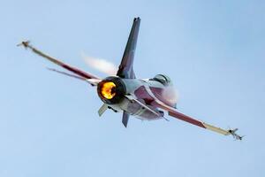 Royal Danish Air Force Lockheed F-16 Fighting Falcon fighter jet plane flying. Aviation and military aircraft. photo