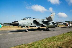 Military fighter jet plane at air base. Air force flight operation. Aviation and aircraft. Air defense. Military industry. Fly and flying. photo