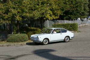 BibbianoReggio Emilia Italy 07 15 2015 Free rally of vintage cars in the town square Fiat 850 Coupe. High quality photo