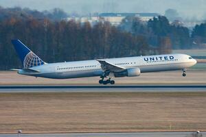 United Airlines passenger plane at airport. Schedule flight travel. Aviation and aircraft. Air transport. Global international transportation. Fly and flying. photo