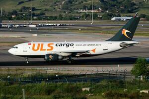 ULS turkish cargo plane at airport. Air freight and shipping. Aviation and aircraft. Transport industry. Global international transportation. Fly and flying. photo