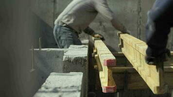 Builders install beams for formwork video