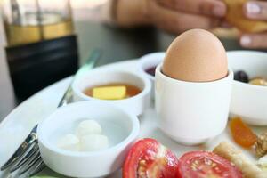 Close egg in cups for morning breakfast photo