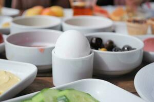 Close egg in cups for morning breakfast photo