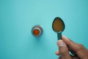 cough syrup on a spoon photo