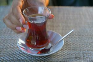 Traditional turkish tea on white table . photo