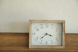 simple modern clock on table photo