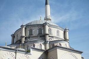 the dome of a mosque against blue sky in istanbul photo