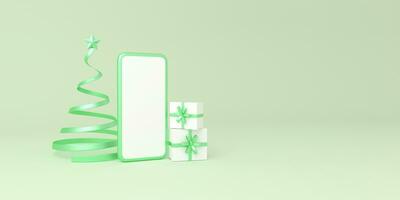 Smartphone with spiral tree christmas and gifts box on green background. photo