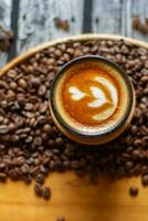 Cafe latte with roasted coffee beans photo