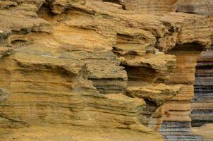 a rock formation with many different colors photo