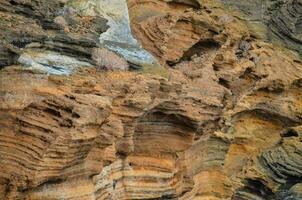 a rock formation with many different colors photo