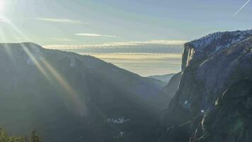 Yosemite Valley at Sunset in Winter. El Capitan and Cathedral Rocks, USA. Time Lapse video