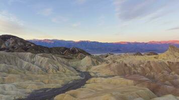 Zabriskie Point at Sunrise. Death Valley National Park. California, USA. Moving Panning Time Lapse video