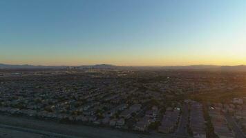 Las Vegas Skyline at Sunrise. Downtown and Residential Neighborhood. Nevada, USA. Aerial View. Drone Flies Upwards video