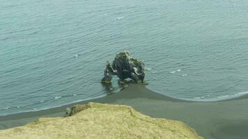 Hvitserkur Rock Formation in Ocean on Summer Day. Iceland. Aerial View. Drone is Orbiting video