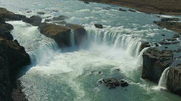 Godafoss Waterfall in Summer Sunny Day. Iceland. Aerial View. Drone Flies Downwards, Tilt Up video